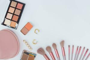 Set of makeup cosmetic accessories on white background. photo