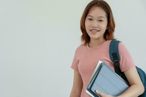 Portrait beautiful Asian woman student. Smile girl happy study. read book in college campus. young female on international Asia University. Education, study, school, learning, exam, continue education photo