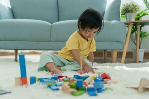 Happy Asia children play and learn toy blocks.family is happy and excited in the house. daughter having fun spending time, Activity, development, IQ, EQ, meditation, brain, muscles, essential skills. photo