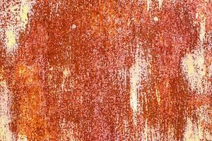 Orande rusty abstract painted metal background. texture of old plate with brown rust photo