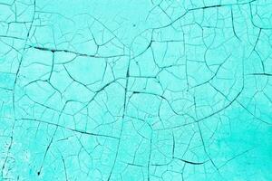 Rusty metal abstract background. Texture of an old blue grunge metal plate with cracked paint. photo