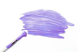 brush with purple color and Abstract acrylic painted spot background. Fluid art texture photo