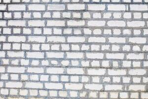 Old brick white color wall background. Light stone texture photo