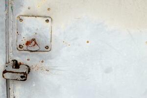 Rusty metal abstract background. Texture of an old blue grunge metal plate with cracked paint. photo