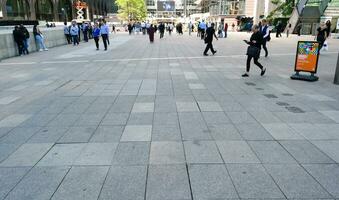 Beautiful View of People at Canary Wharf Central London City of England Great Britain of UK During a Bright Sunny Day. The Image Was Captured on June 08th, 2023 photo