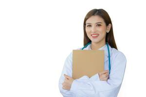 Professional young Asian woman doctor standing with arms crossed happy and smile in hospital wearing white robe and stethoscope while isolated on white background. photo