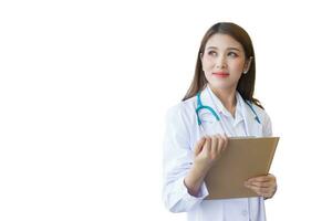 Young professional Asian woman doctor examine report document of patient to plan the next treatment. She is holding  clipboard in her hand while working isolated on white background. photo