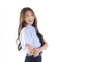 Portrait of adult Thai student in university student uniform. Asian beautiful girl standing with her arms crossed confidently while working isolated on white background. photo