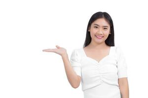 Portrait young Asian woman is smiling and shows her hands to present something while working isolated on white background. photo