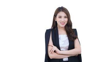 Professional Asian confident business woman is standing and arm crossing with smiling face in working room while isolated on white background. work from home concept photo