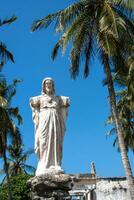 Sacred Heart of Jesus statue with broken arms photo