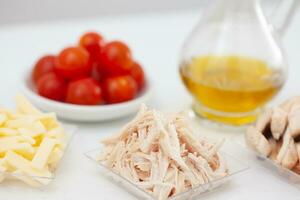 Chicken and mushrooms pizza topping ingredients. Pizza preparation. photo