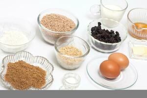 Wheat bran muffins preparation. Ingredients to prepare integral wheat bran muffins photo