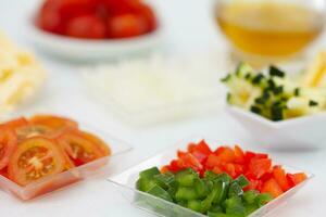 Vegetables pizza topping ingredients. Pizza preparation. photo