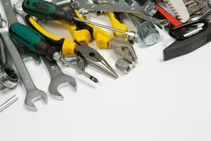 Set of tools for repair in a case on a white background. Assorted work or construction tools. Wrenches, Pliers, screwdriver. Top view photo