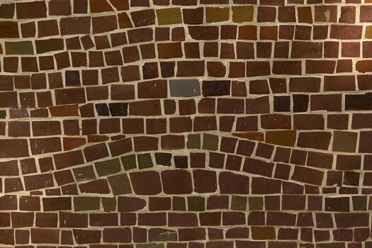 Colorful ceramic mosaic on the walls of the building. Abstract background and texture for design. photo
