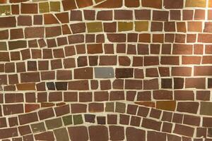 Colorful ceramic mosaic on the walls of the building. Abstract background and texture for design. photo