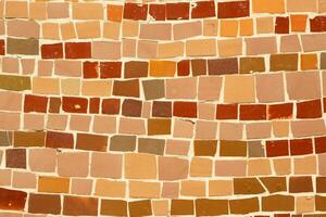 Colorful ceramic mosaic on the walls of the building. Abstract background and texture for design. photo