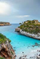 Calo des Moro, Majorca, Spain. Beautiful beach landscape, exotic tropical island nature, blue sea water, ocean waves, summer holidays vacation. photo