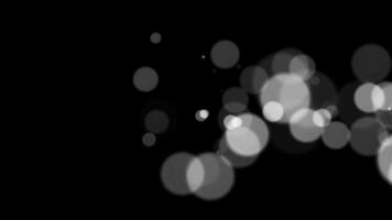 Abstract white glitter and particle on black background. Looped animation with beautiful white bokeh on black background. video