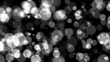 Abstract white glitter and particle on black background. Looped animation with beautiful white bokeh on black background. video