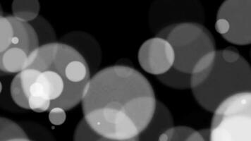 Abstract white glitter and particle on black background. Looped animation with beautiful white bokeh on black background. video