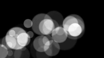resumen blanco Brillantina y partícula en negro antecedentes. serpenteado animación con hermosa blanco bokeh en negro antecedentes. video