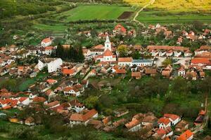 Rimetea is a small village located in Transylvania, Romania. It is situated in the Apuseni Mountains and is known for its picturesque setting and well preserved Hungarian architectural style. photo