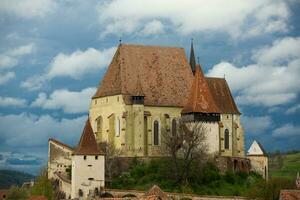 Biertan a very beautiful medieval village in Transylvania, Romania. A historical town in Romania that has preserved the Frankish and Gothic architectural style. Travel photo. photo