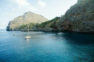 Torrent de Pareis Sa Calobra Mallorca, Spain. Beautiful sunset beach landscape, exotic tropical island nature, blue sea water, ocean waves, summer holidays vacation photo