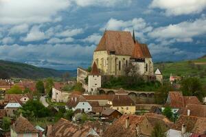 Biertan a very beautiful medieval village in Transylvania, Romania. A historical town in Romania that has preserved the Frankish and Gothic architectural style. Travel photo. photo