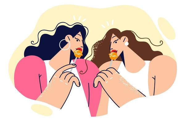 Twin girls with lollipops seductively eat sweets on stick and try to attract attention of men. Beautiful women with lollipops are invited to enjoy taste of new sweets made at confectionery factory