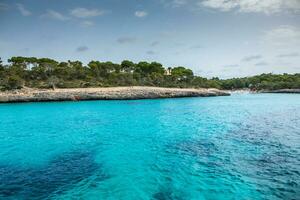 Beautiful sunset beach landscape, exotic tropical island nature, blue sea water, ocean waves, colorful red yellow sky, summer holidays vacation in Mallorca, Spain photo