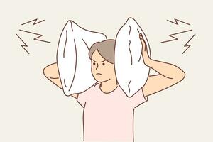 Irritated woman covers ears with pillow so as not to hear noise from neighbors who are having party. Gloomy girl tries to escape from loud music that interferes with sleep and closes ears vector