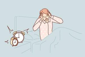 Woman wakes up with difficulty early in morning and closes ears sitting in bed near bedside table with alarm clock. Girl in pajamas wakes up before work and needs extra rest due to overwork vector