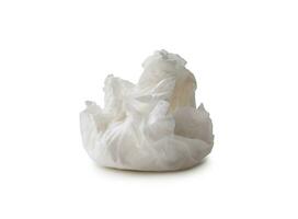 Single screwed or crumpled tissue paper or napkin in strange shape after use in toilet or restroom isolated on white background with clipping path. photo