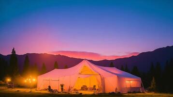 Camping in the mountains at sunset. photo