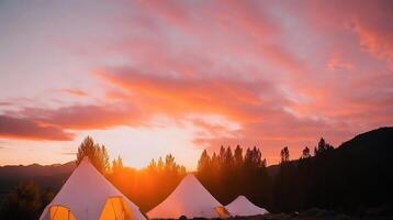 Camping in the mountains at sunset. photo