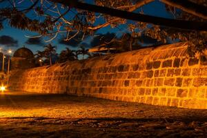 View of the wall surrounding Cartagena de Indias in Colombia at dusk photo