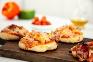 Delicious just baked homemade mini pizzas. photo