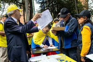 Bogota, Colombia, 16 August 2023. People signing for the Cabildo Abierto. Marche asking for Gustavo Petro impeachment. photo