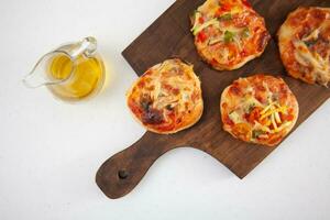 Delicious just baked homemade mini pizzas. photo