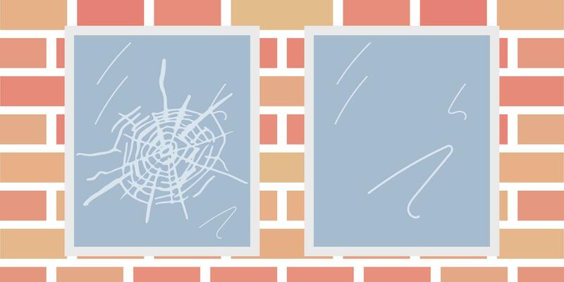 Destroyed window on street wall. Vandalism actions