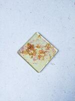 Handmade resin coaster with floral pattern on white background. Selective focus. photo