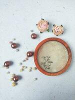 Handmade resin coaster with floral pattern on white background. Selective focus. photo