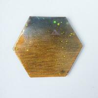 Handmade resin coaster with floral pattern on white background. Selective focus. photo