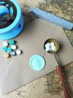 Old letter with wax seal and wax seal on old map background. photo