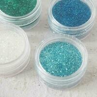 blue glitter and sparkles on white background. photo