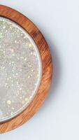 Handmade resin coaster with floral pattern on white background. Selective focus. photo