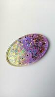 Handmade resin coaster with floral pattern on white background. Selective focus. photo